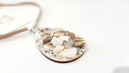 Shell necklace on wooden board with Suede leather chain