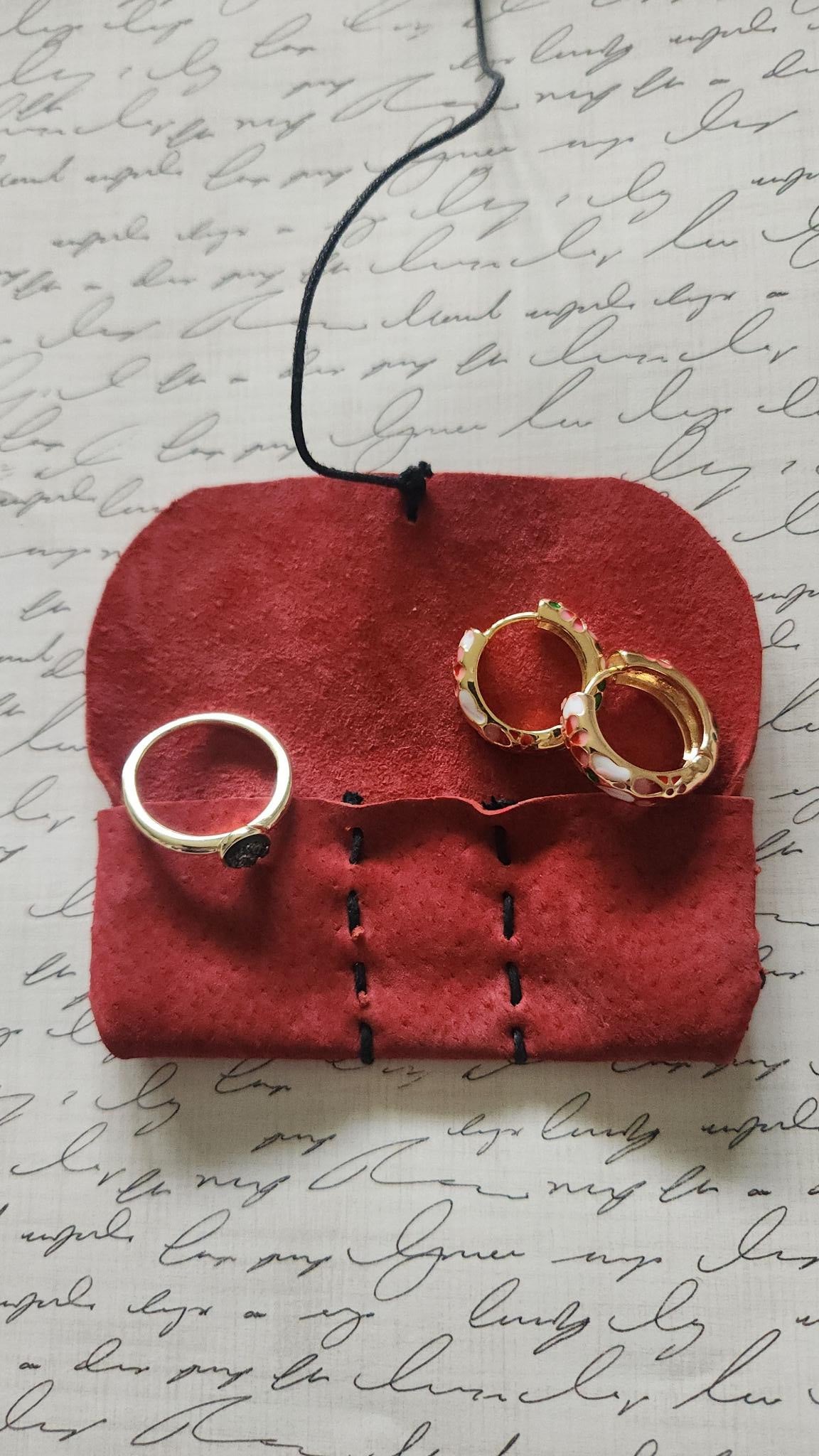 Handmade suede leather pouch (1.5" x 3.5") with 3 compartments, perfect for keeping rings, earrings, necklaces, or bracelets safe and scratch-free. Compact, elegant, and travel-friendly
