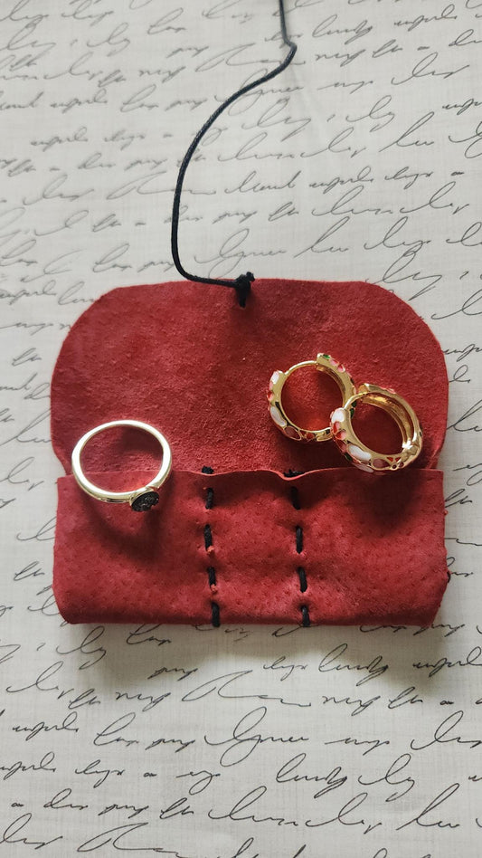 Handmade suede leather pouch (1.5" x 3.5") with 3 compartments, perfect for keeping rings, earrings, necklaces, or bracelets safe and scratch-free. Compact, elegant, and travel-friendly